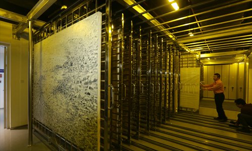 The storehouse of an art trade center in the month-old Shanghai Free Trade Zone is unveiled on Tuesday. The 3,000-square meter storehouse, which is for paintings, statues and other art works, has attracted art dealers such as Christie's. Photo: CFP