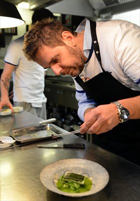 World-famous chef Wojciech Modest Amaro prepares a dish at his restaurant Atelier Amaro in Warsaw in May. Photo: AFP 