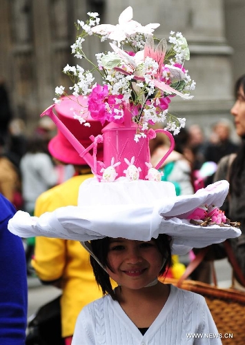 A girl with a unique bonnet takes part in the annual Easter Bonnet Parade in Manhattan of New York, the United States, March 31, 2013. With a history of more than 100 years, the New York Easter Bonnet Parade is held annually on the 5th Avenue near the Saint Patrick's Cathedral. Adults, children and even pets in creative colorful bonnets and outfits participate in the event, which also attract thousands of New York residents and tourists. (Xinhua/Deng Jian) 