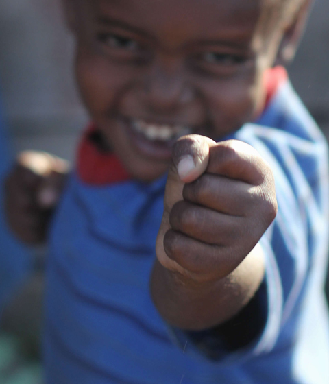 A young Kitengela boy poses for a photo at the camera near his home in the Maasai village outside of Nairobi on February 10, 2013. Photo: Li Jian/GT