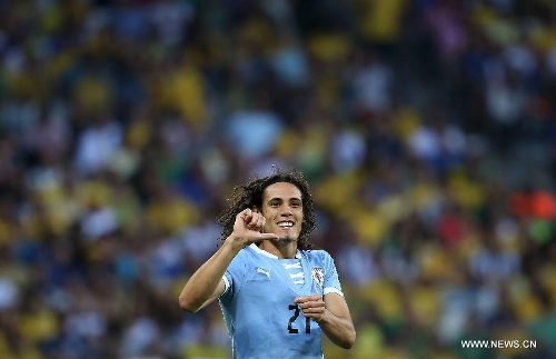 Uruguay's Edinson Cavani celebrates after scoring, during the FIFA's Confederations Cup Brazil 2013 semifinal match against Brazil, held at Mineirao Stadium, in Belo Horizonte, Minas Gerais state, Brazil, on June 26, 2013. (Xinhua/Liao Yujie)