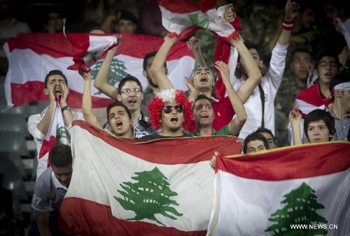 Supporters of Lebanon cheer during the 2014 World Cup Qualification Asia match against Iran at Azadi stadium in Tehran, Iran, June 11, 2013. Lebanon lost 0-4. (Xinhua/Ahmad Halabisaz) 