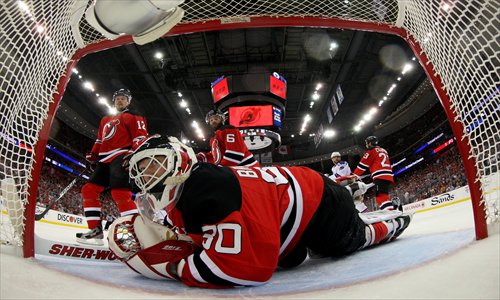 Martin Brodeur (No.30) of the New Jersey Devils looks on after making a save against the New York Rangers on May 25. Photo: AFP