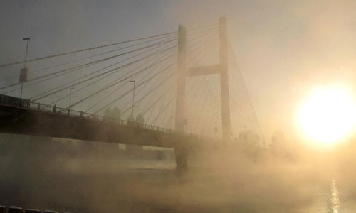 Photo taken on January 4, 2013 shows the morning fog scenery alongside the Songhua River in the city of Jilin, northeast China's Jilin Province. Photo: Xinhua