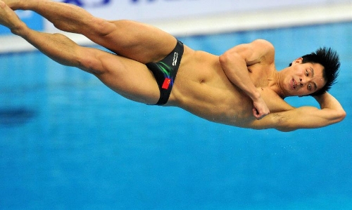 He Chong of China competes during the men's 3m springboard final at the FINA Diving World Series 2013 held at the Aquatics Center, in Beijing, capital of China, on March 16, 2013. He Chong took the 2nd place with 521.50 points. (Xinhua/Gong Lei)