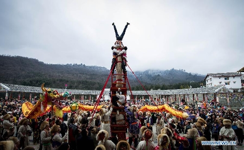 People of the Tibetan ethnic group perform at the Shangjiu Festival in Baoxing County, southwest China's Sichuan Province, Feb. 18, 2013. The residents of Tibetan ethnic group in Baoxing on Monday celebrated the annual Shangjiu Festival, which means the 9th day of Chinese Lunar New Year, to express the respect to the heaven. (Xinhua/Jiang Hongjing)  