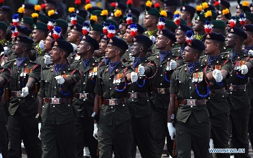 Sri Lankan army personnel march during the Victory Day parade in Colombo, Sri Lanka, May 18, 2013. Sri Lanka on Saturday celebrated the fourth anniversary of the defeat of the Tamil Tiger rebels after 30 years of war. (Xinhua/Pushpika Karunaratne) 