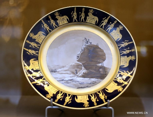 Photo taken on May 4, 2013 shows a porcelain plate made in the 19th century displayed in an exhibition of 