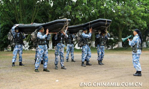 An armored regiment of the Marine Corps under the Navy of the Chinese People's Liberation Army (PLA) keeps the actual-combat requirements in mind and tempers its troops all-roundly. By adding the obstacles and setting up lifelike battle atmosphere in training, the regiment has cultivated the first-rate capability of the officers and men. (China Military Online/Zeng Liang)