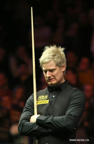 Neil Robertson of Australia reacts during the Masters Snooker final against England's Mark Selby in London, Britain, Jan. 20, 2013. (Xinhua/Yin Gang) 