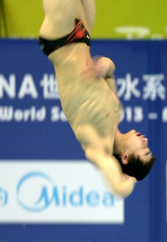 Qin Kai of China competes during the men's 3m springboard semifinal B at the FINA Diving World Series 2013 held at the Aquatics Center, in Beijing, capital of China, on March 16, 2013. Qin Kai enter the final with 505.55 points. (Xinhua/Guo Yong) 