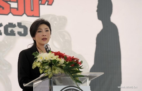 Thai Prime Minister Yingluck Shinawatra speaks at Central Bangkwang Prison in Nonthaburi Province, Thailand, on May 15, 2013. More than 500 prisoners who committed serious crimes have had the handcuffs and foot shackles removed in Thailand. (Xinhua/Gao Jianjun) 