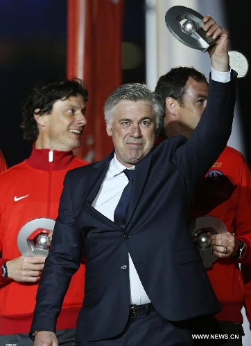 Paris Saint-Germain's manager Carlo Ancelotti reacts during the celebration for winning the French League 1 title after the League 1 football match between Paris St Germain and Brest at Parc des Princes stadium in Paris on May 18, 2013. (Xinhua/Wang Lili) 