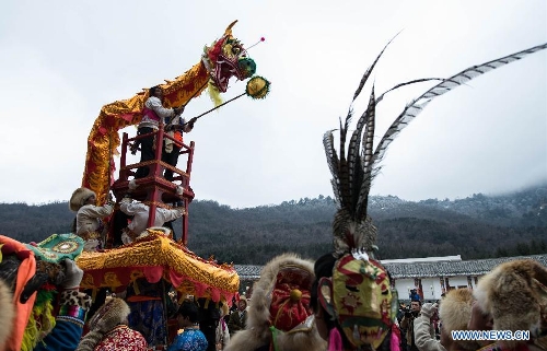 People of the Tibetan ethnic group perform at the Shangjiu Festival in Baoxing County, southwest China's Sichuan Province, Feb. 18, 2013. The residents of Tibetan ethnic group in Baoxing on Monday celebrated the annual Shangjiu Festival, which means the 9th day of Chinese Lunar New Year, to express the respect to the heaven. (Xinhua/Jiang Hongjing)  