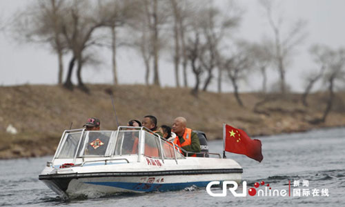 Chinese tourists travel on the Yalu River which runs between China’s Liaoning Province and North Korea on April 6. Photo: CFP/CRI