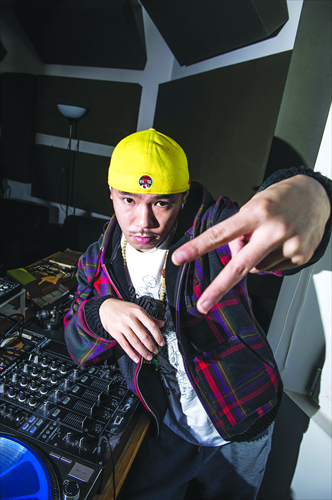 Wang Bo, aka MC Webber, takes a break from mixing tracks at his Chaoyang district studio. Wang is considered a pioneer of Chinese mainland hip-hop. Photo: Li Hao/GT 