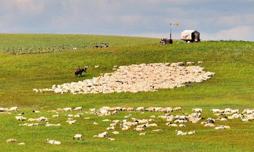 Photo taken on July 23, 2012 shows a sunset glow over New Barag Left Banner Grassland, north China's Inner Mongolia Autonomous Region. With a beautiful scenery, New Barag Left Banner Grassland attracts a large amount of visitors in summer. Photo: Xinhua