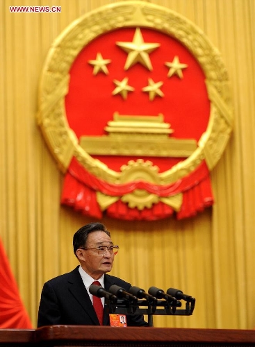 Wu Bangguo delivers a work report of the Standing Committee of the National People's Congress (NPC) during the second plenary meeting of the first session of the 12th NPC at the Great Hall of the People in Beijing, capital of China, March 8, 2013. (Xinhua/Xie Huanchi)