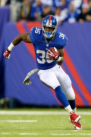 Andre Brown of the New York Giants carries the ball in the game against the Oakland Raiders on Sunday. Photo: AFP