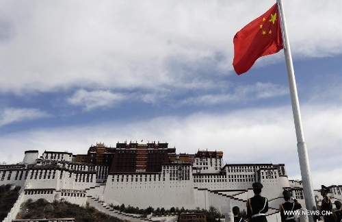 A flag-raising ceremony is held in front of the Potala Palace to mark the 54th anniversary of the abolishment of Tibet's feudal serfdom in Lhasa, capital of southwest China's Tibet Autonomous Region, March 28, 2013. Authorities have designated March 28 as the day to commemorate the 1959 democratic reform in Tibet, which ended the feudal serf system. The reform freed about 1 million Tibetans, over 90 percent of the region's population at the time, from a life of serfdom. (Xinhua/Purbu Zhaxi) 