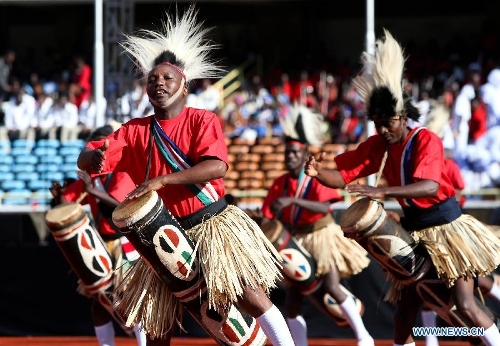 Actors perform during Uhuru Kenyatta's inauguration ceremony at Moi International Sports Center in Nairobi, capital of Kenya, April 9, 2013. Kenya's President Uhuru Kenyatta officially took office on Tuesday after being sworn into office as the East African nation's fourth president. (Xinhua/Meng Chenguang)