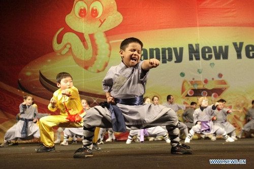 Local kids perform wushu, or martial art, during the 