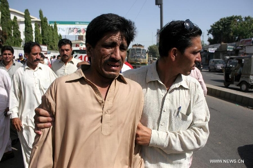 Pakistanis mourn for the death of Sadiq Zaman Khattak, candidate for a National Assembly seat of the ethnic Pashtoon 