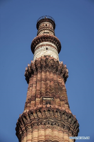 Photo taken on April 5, 2013 shows the top part of Qutab Minar in New Delhi, India. Qutab Minar, a UNESCO World Heritage Site, is the tallest minaret in India. It is 75.56 metres high with a base a diameter of 14.3 metres, which narrows to 2.7 metres at the top storey. The minar is made of red sandstone and marble, and covered with intricate carvings. The construction of Qutab Minar started in 1193 by Qutub-ud-din Aibak and was completed by his inheritor Iltutmish. It is surrounded by several other ancient and medieval structures and ruins, collectively known as the Qutub complex, which attracts many visitors till now. (Xinhua/Zheng Huansong) 