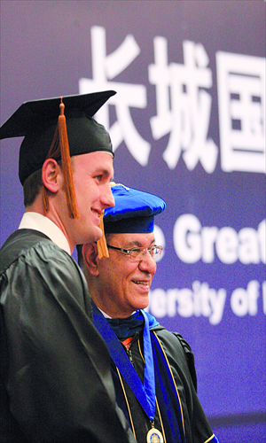 Two foreign students attend their MBA graduation ceremony at the Tianjin University of Finance & Economics on May 15 2010. Photo: CFP