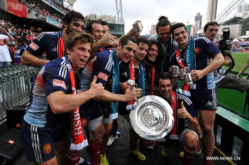 Team France pose with their trophies after a match against Argentina at the Hong Kong Sevens rugby tournament in south China's Hong Kong, March 24, 2013. France won the match 19-14 to win the 13th place. (Xinhua/Lo Ping Fai) 