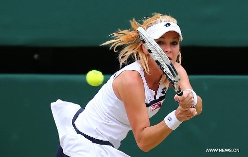 Agnieszka Radwanska of Poland returns the ball during the quarterfinal of women's singles against Li Na of China on day 8 of the Wimbledon Lawn Tennis Championships at the All England Lawn Tennis and Croquet Club in London, Britain on July 2, 2013. Agnieszka Radwanska won 2-1. (Xinhua/Yin Gang)  