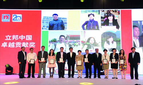  Staff pose for camera and toast their 