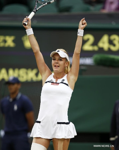 Agnieszka Radwanska of Poland celebrates for victory after the quarterfinal of women's singles against Li Na of China on day 8 of the Wimbledon Lawn Tennis Championships at the All England Lawn Tennis and Croquet Club in London, Britain on July 2, 2013. Agnieszka Radwanska won 2-1. (Xinhua/Wang Lili) 