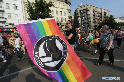 A rainbow flag with Anti-homophobia written on is seen during the Gay Pride Parade in Budapest, Hungary on July 6, 2013. (Xinhua/Attila Volgyi) 