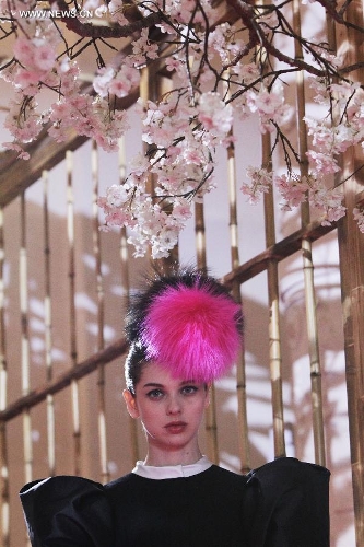 A model presents a creation by French fashion designer Christian Lacroix for Italian fashion house Elsa Schiaparelli in Paris, France, July 1, 2013. (Xinhua/Gao Jing)