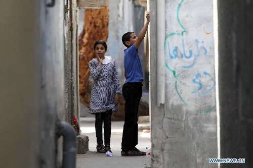 Palestinian children play in the al-Shati refugee camp in Gaza City on March 13, 2013. About 700,000 Palestinians left their homes and settled in refugee camps in the Gaza Strip, the West Bank and neighboring Arab countries. (Xinhua/Yasser Qudih) 