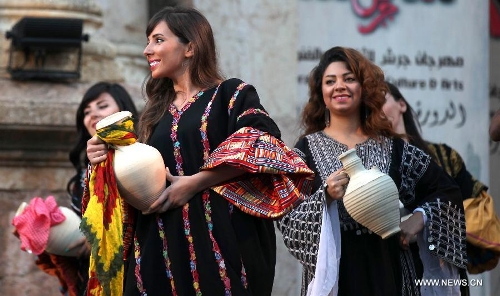 Performers participate in the opening ceremony of Jordan's annual Jerash Festival, hosted in the ancient Greco-Roman city, 45 km north of Amman, on June 26, 2013. (Xinhua/Mohammad Abu Ghosh) 