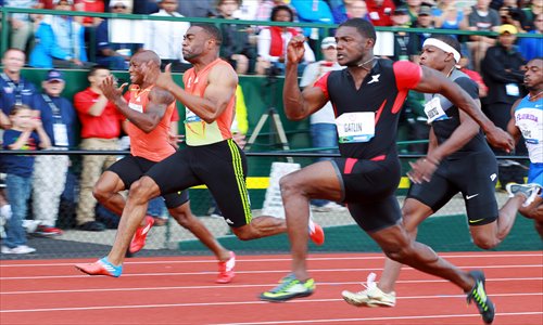 Justin Gatlin (right) competes against Tyson Gay (second from left) during the men’s 100m dash final. Photo: IC