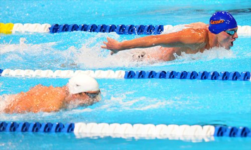 Ryan Lochte (top) swims to victory in the men’s 400m individual medley ahead of Michael Phelps. Photo: IC