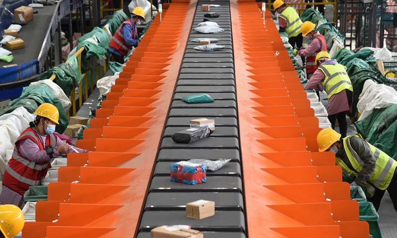 Workers sort parcels on an automated delivery line of China Post Group in Handan, North China’s Hebei Province on Monday. As the Double 11 Shopping Festival approaches, some logistics companies have installed machines to improve delivery efficiency. Photo: cnsphoto