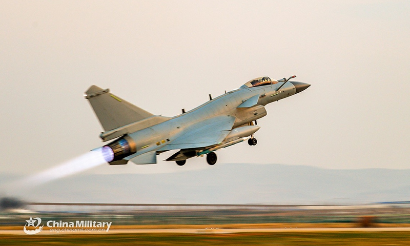 A fighter jet attached to an air force aviation brigade under the PLA Southern Theater Command takes off during a round-the-clock flight training exercise on March 4, 2021.Photo:China Military