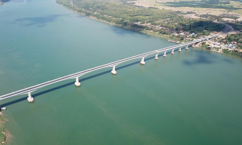 Aerial photo taken on March 11, 2021 shows the eighth Cambodia-China Friendship Bridge across the Mekong River, connecting Kampong Cham province and Tboung Khmum province in southeastern Cambodia. Construction work on the eighth Cambodia-China Friendship Bridge was completed earlier than schedule despite the COVID-19 pandemic, Cambodian Minister of Public Works and Transport Sun Chanthol said on Tuesday.Photo:Xinhua