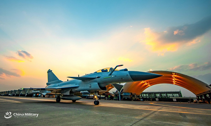 A fighter jet attached to an air force aviation brigade under the PLA Southern Theater Command taxies on the flightline before takeoff during a round-the-clock flight training exercise on March 4, 2021.Photo:China Military