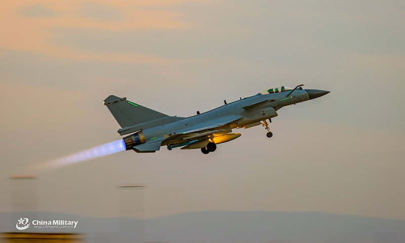 A fighter jet attached to an air force aviation brigade under the PLA Southern Theater Command takes off during a round-the-clock flight training exercise on March 4, 2021.Photo:China Military