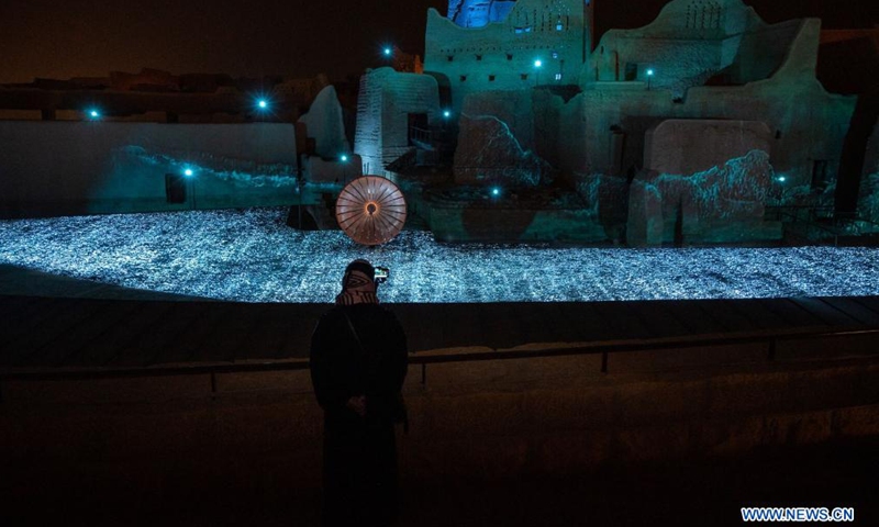 A visitor is seen at a light exhibition during Noor Riyadh light festival in Riyadh, Saudi Arabia, on March 18, 2021. Noor Riyadh, an annual light festival to exhibit illuminative artworks across the Saudi capital, will help discover and nurture local talents and artists, said an official at the Royal Commission for Riyadh City (RCRC).Photo:Xinhua