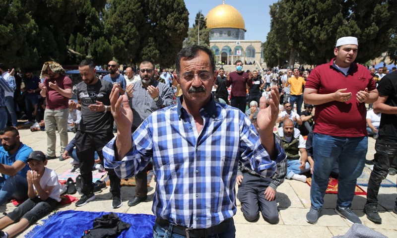 Muslims pray in front of the Dome of the Rock in Jerusalem's Old City on April 23, 2021.(Photo: Xinhua)