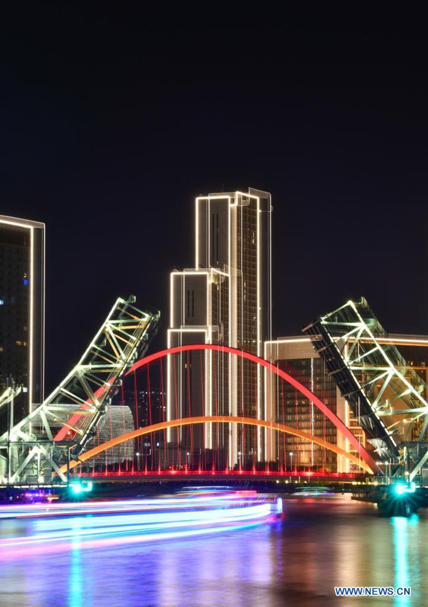 Long-exposure photo taken on May 1, 2021 shows the night view of the Jiefang Bridge in Tianjin, north China. (Xinhua/Sun Fanyue)