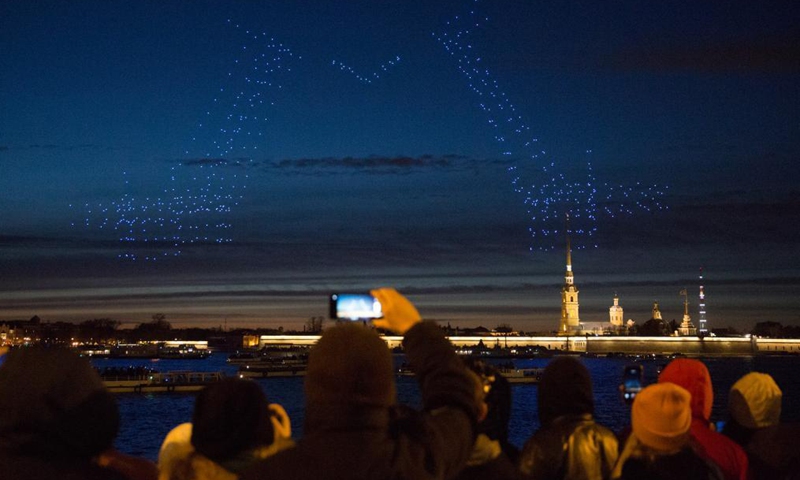 Various formations made by drones are seen over the sky of St. Petersburg, Russia, May 2, 2021. The first International Drone Festival was held in St. Petersburg on May 2. (Photo by Irina Motina/Xinhua) 