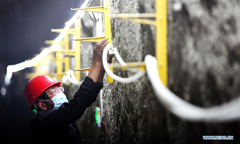 A worker from China Railway Seventh Group Co., Ltd. works at the construction site of a railway station of Xi'an Subway Line 8 in Xi'an City, capital of northwest China's Shaanxi Province, May 1, 2021. People from various sectors stick to their posts during the Labor Day holiday. Photo: Xinhua