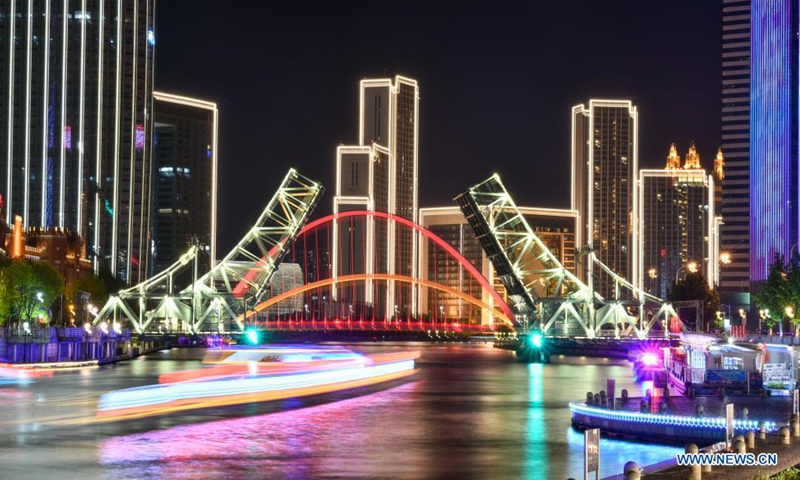 Long-exposure photo taken on May 1, 2021 shows the night view of the Jiefang Bridge in Tianjin, north China. (Xinhua/Sun Fanyue)